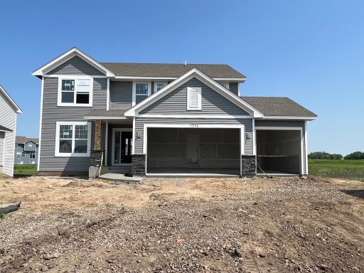 A stunning display from the street, introducing Lennar's popular Lewis plan. This home comes complete with irrigation, landscaping, trees and a full yard of sod!