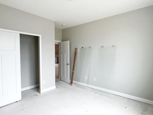 Main level guest suite with adjacent 3/4 bath perfect for visitors, or a multi-purpose space.