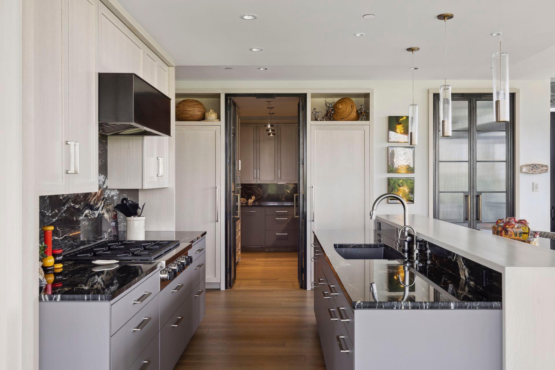 Introducing the Prep Kitchen with double doors at either end for convenient screening.