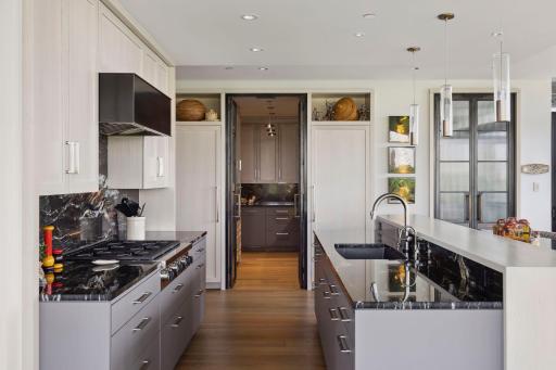 Introducing the Prep Kitchen with double doors at either end for convenient screening.