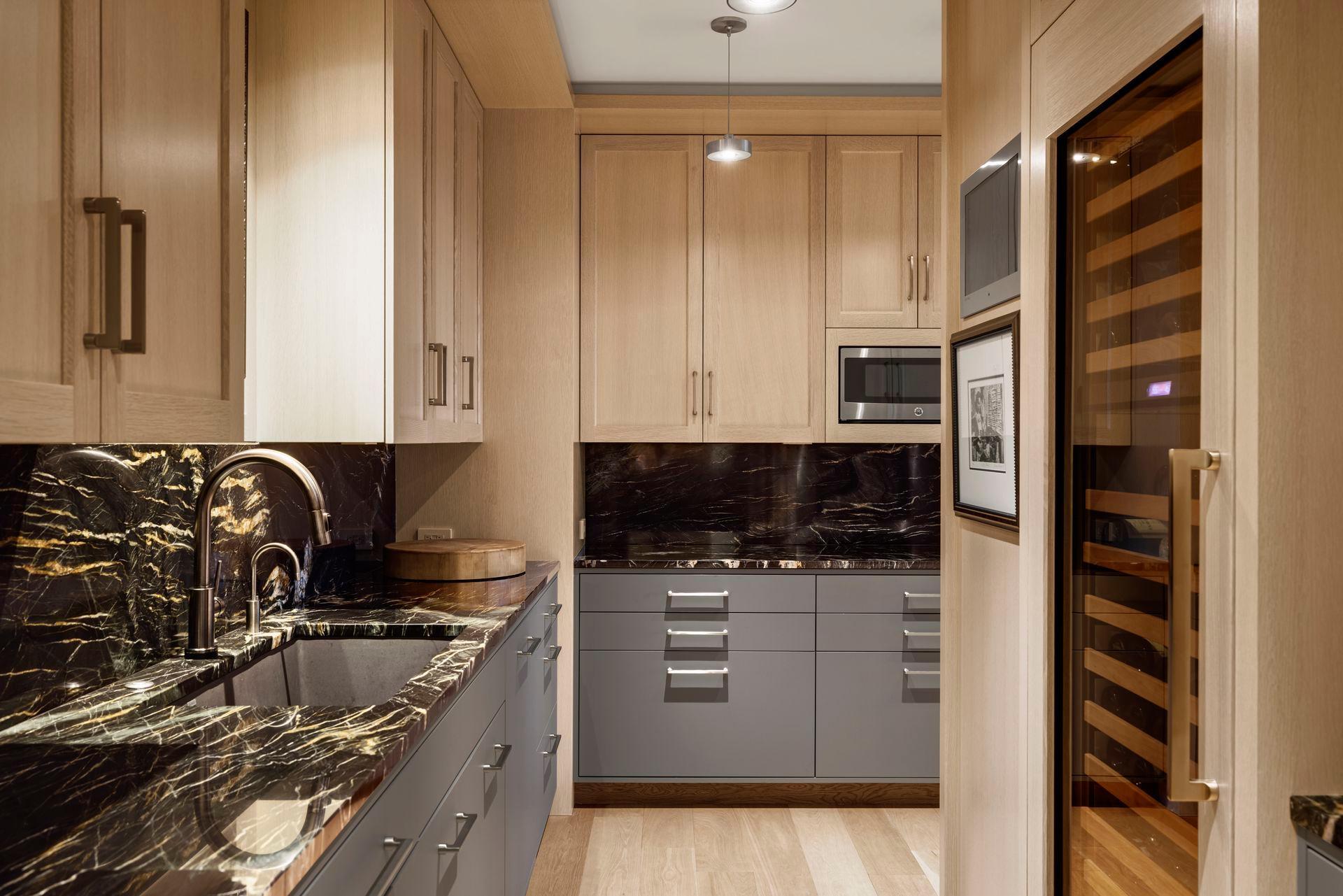 Note the deep Blanco sink and second dishwasher. The Sub-Zero wine refrigerator holds 146 bottles. A flush mount Seura TV and ceiling speakers add to the enjoyment.