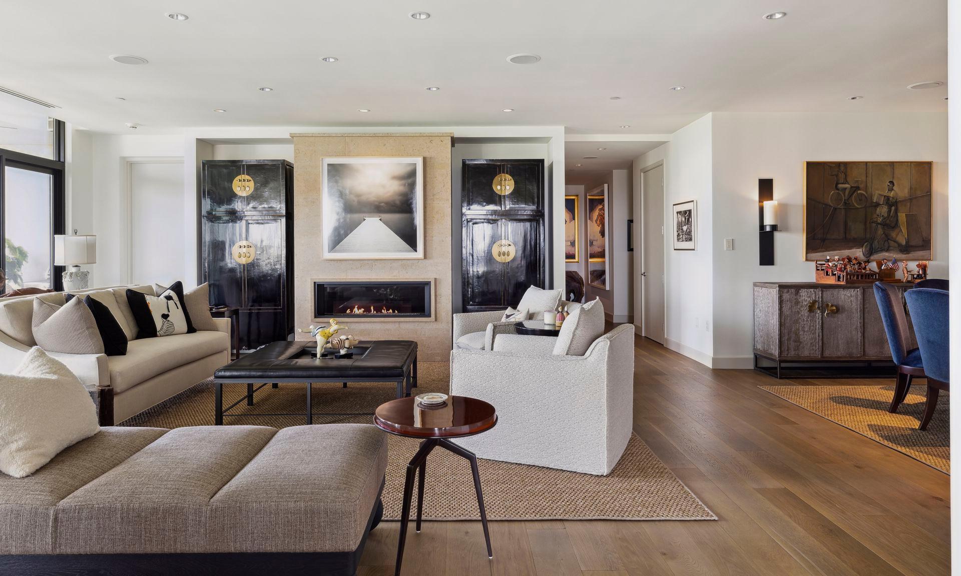 Step from the elevator directly into this home's foyer where you can follow a hallway to powder room, 2nd and 3rd bedrooms, bath and laundry or enter this living room.