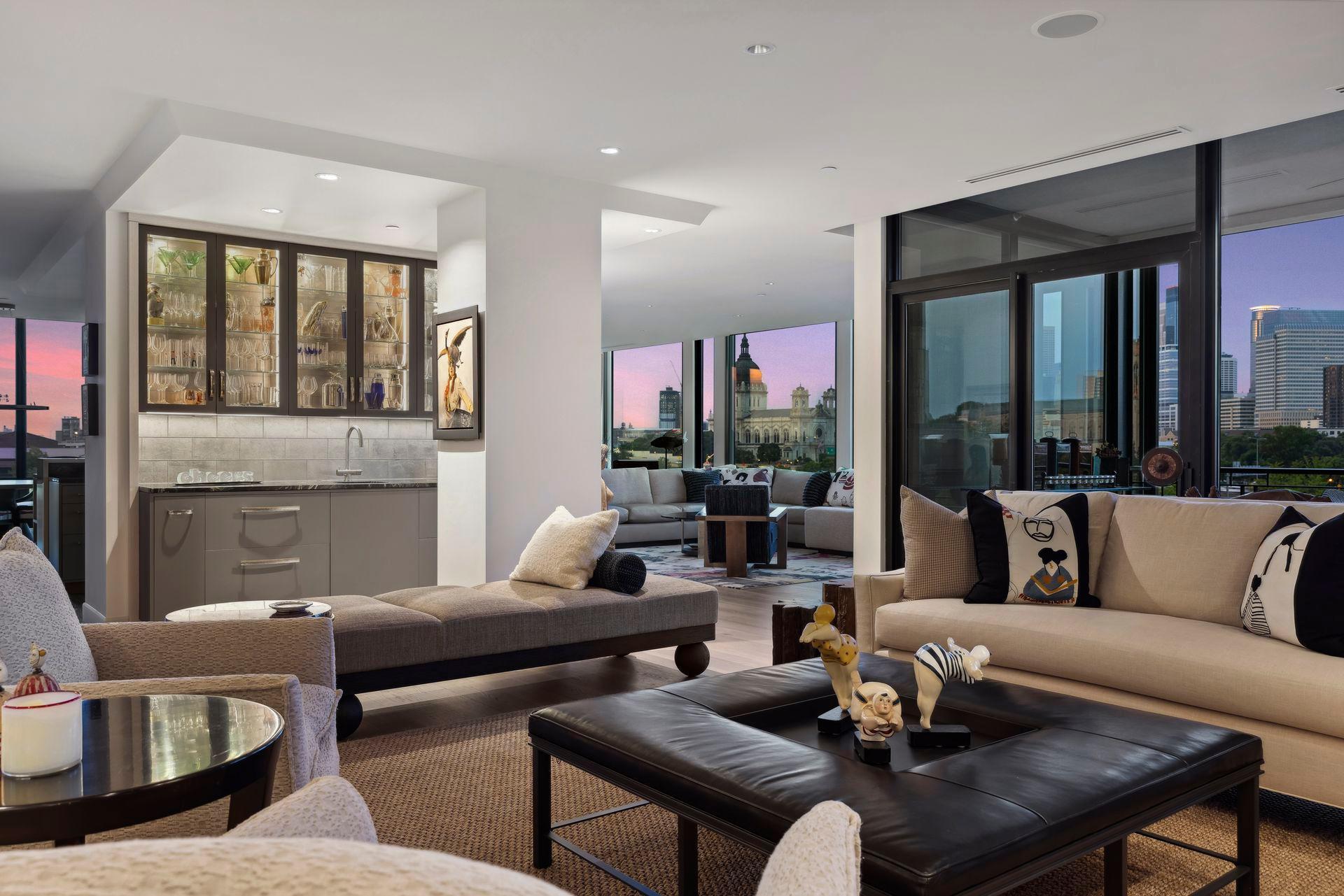 At dusk the mood changes as the sky becomes a work of art. Lutron shades in ceiling pockets offer touch button privacy in any configuration.