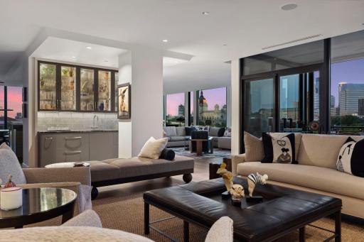 At dusk the mood changes as the sky becomes a work of art. Lutron shades in ceiling pockets offer touch button privacy in any configuration.