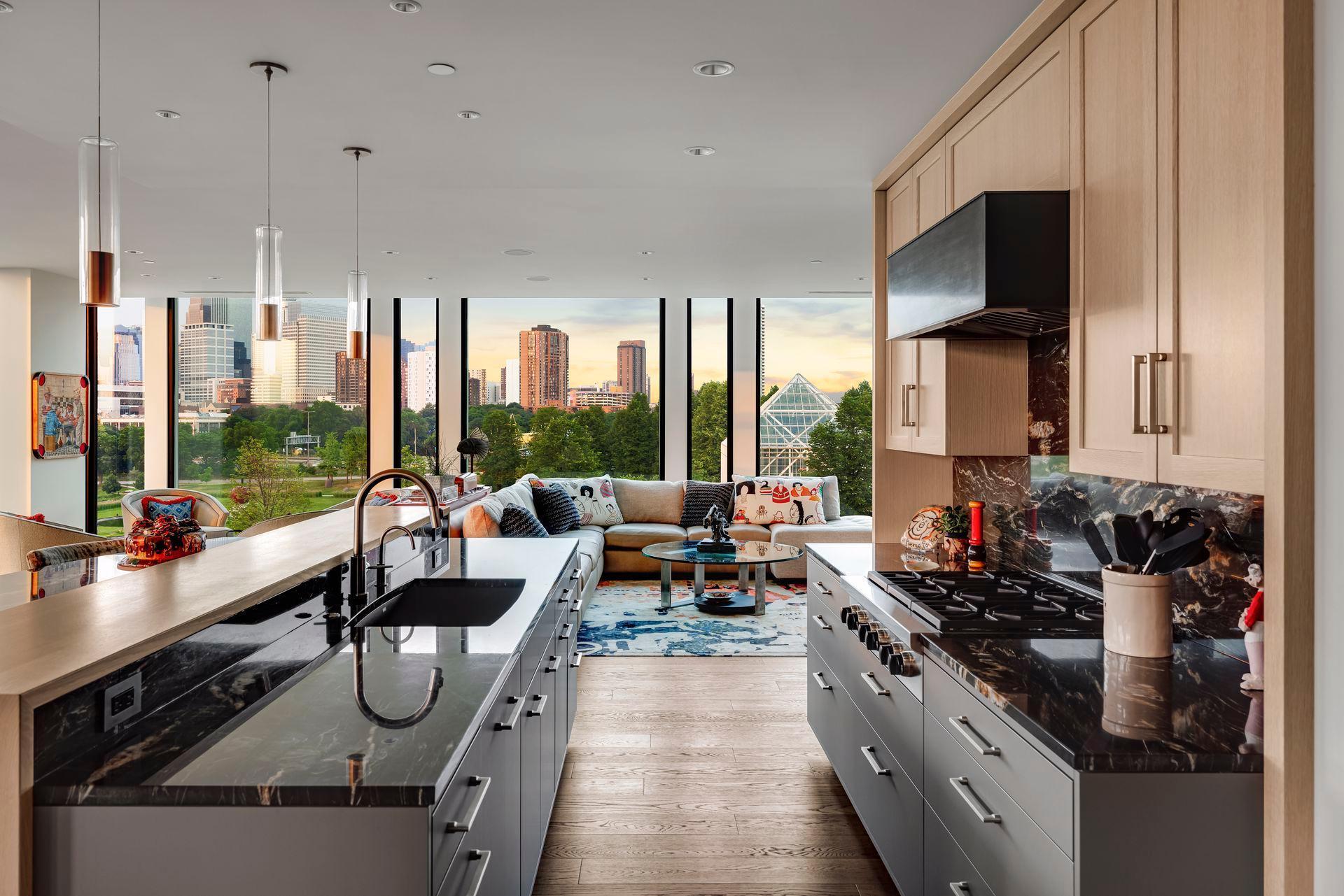 The Wolf range is topped by a custom fabricated steel hood echoing the fireplace.