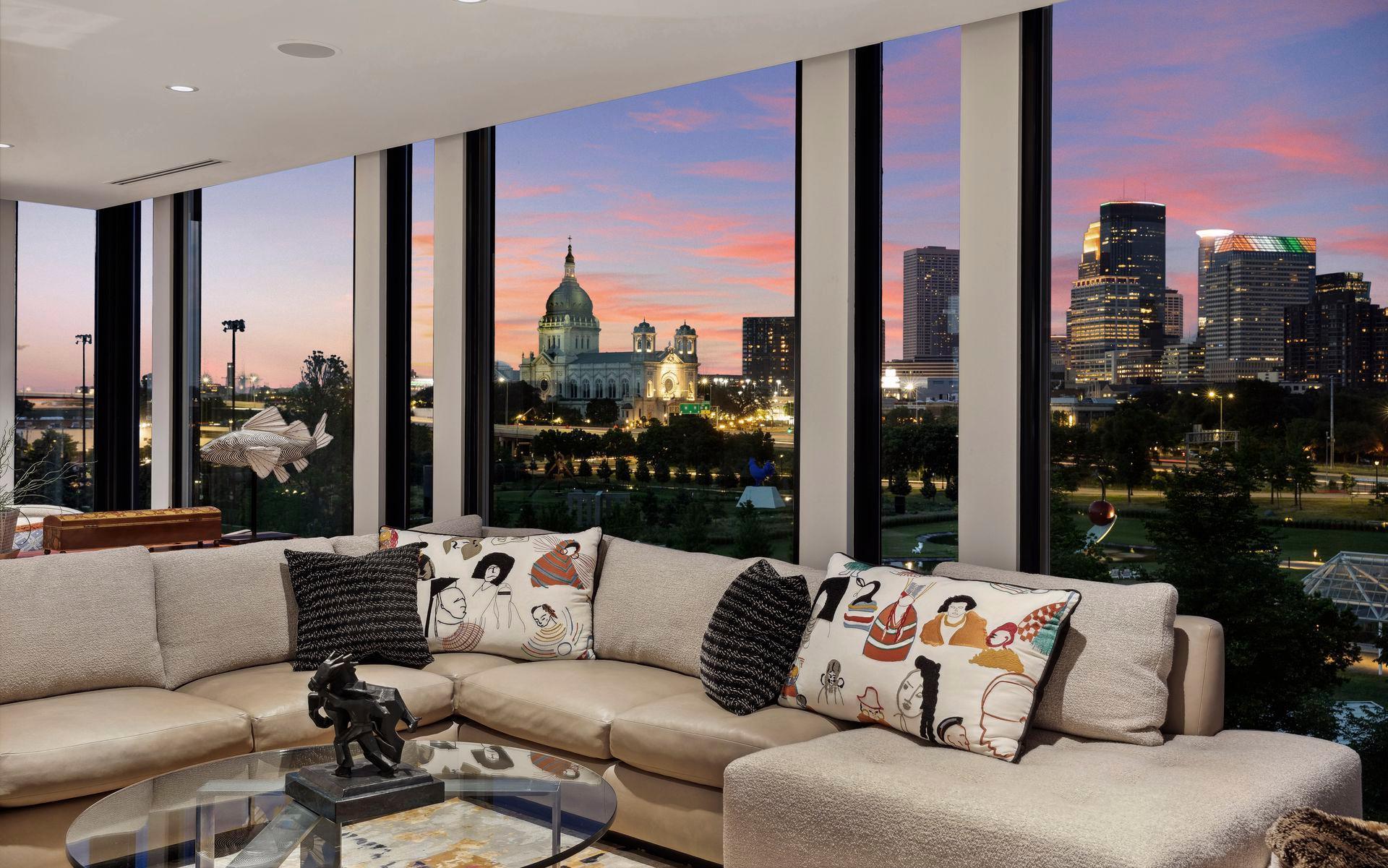 The night skyline glows with iconic buildings.