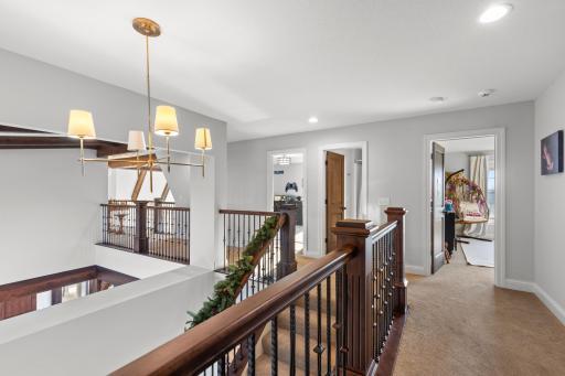 Upstairs leads to 2 bedrooms, balcony & spacious additional living space