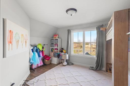 Secret room behind the bookcase makes a great playroom/bonus space