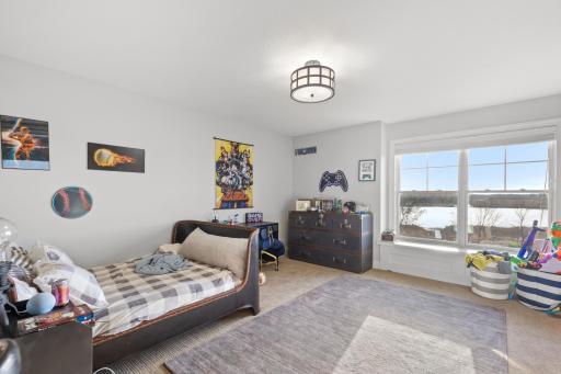Upper level bedroom 2 features a lovely window bench to enjoy the views