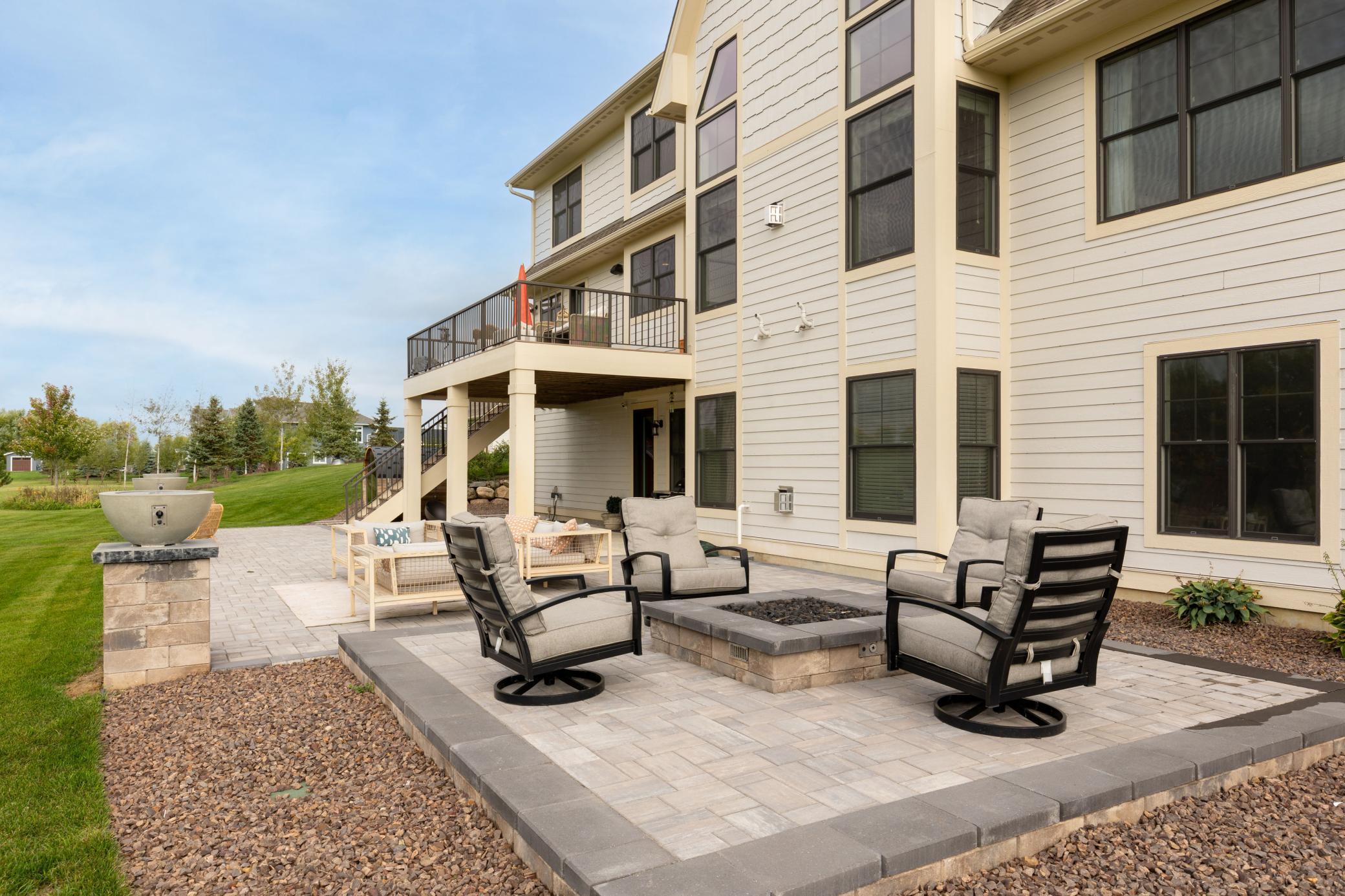 Enjoy the warmth outside at the built-in gas firepit on the patio