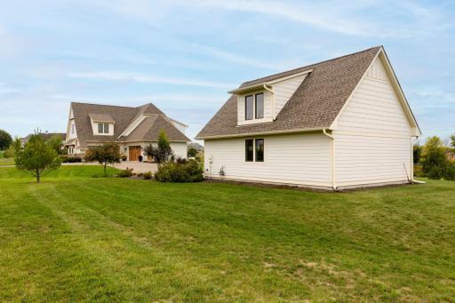 Spacious detached heated garage with upper level living/rec space