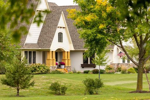 Freshly updated exterior pops against the beautiful landscaping