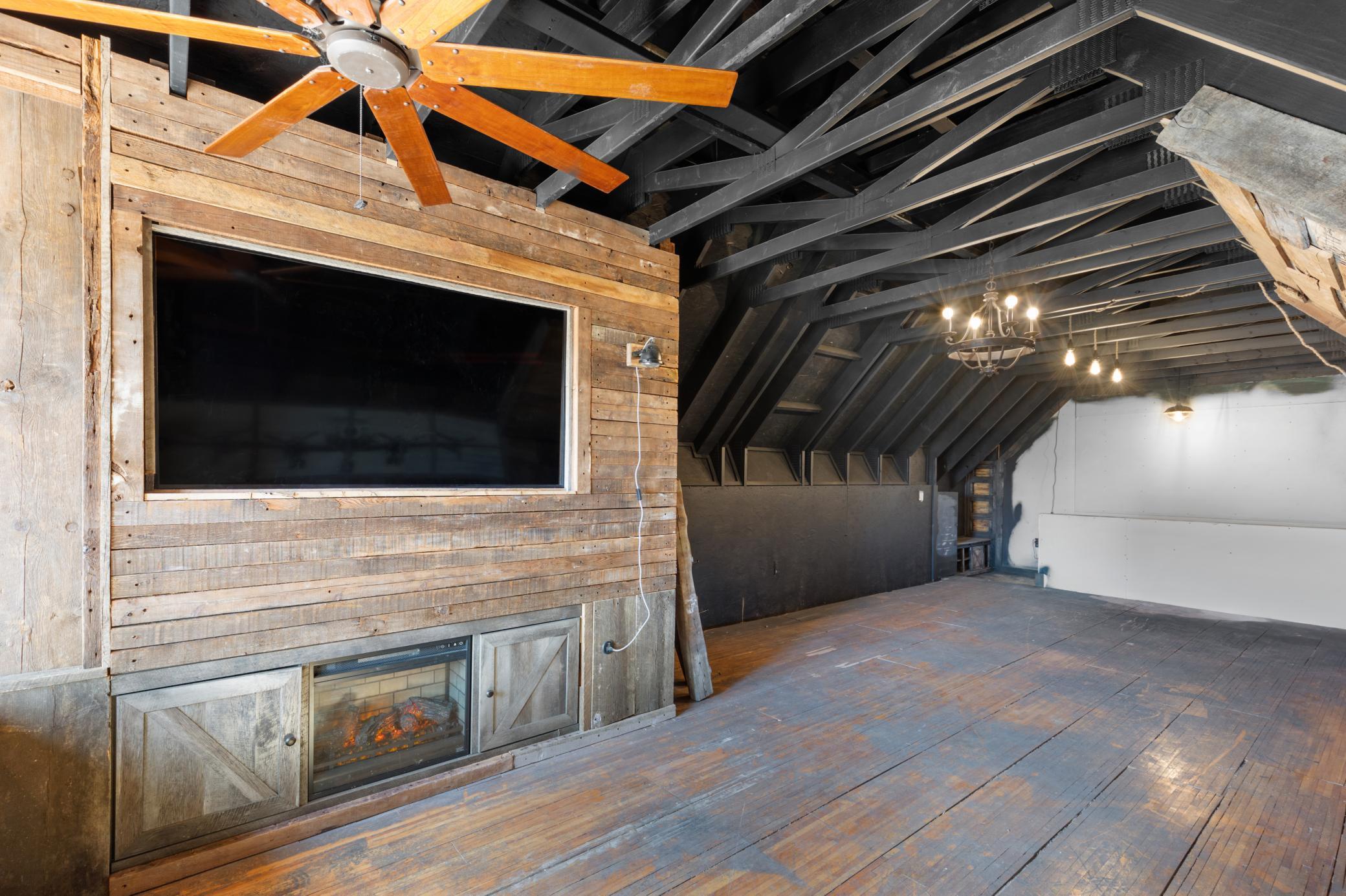 Complete with a built-in TV, fireplace, new light fixtures and ceiling fan this spot is the perfect place to hang