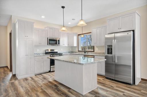 MODEL PHOTO - This home has WHITE CABS. Gourmet kitchen beautifully and thoughtfully designed! Everything you need including the custom cabinetry and pantry!