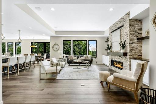 Beautiful view from foyer with views leading to the private back yard flanked by Large mature trees. Huge oversize Pella windows provide commanding views over this property. Large fireplace w/thermostatically controlled remote.
