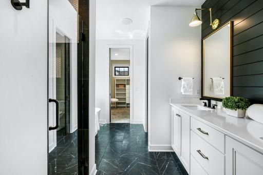 Owners bath with dual vanity sinks, walk-in separate shower .