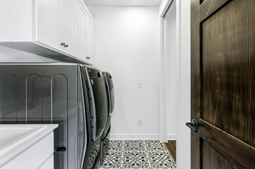 Main floor laundry walks through to master closet.