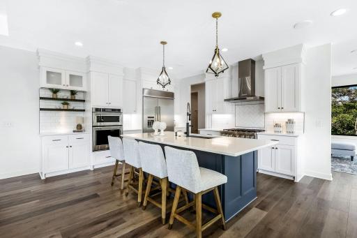 Beautiful center island with sink and work station, Center island with storage on both sides, Double oven & Convection microwave, reverse osmosis drinking water. Floating shelves, undercabinet lighting, Custom spice rack..