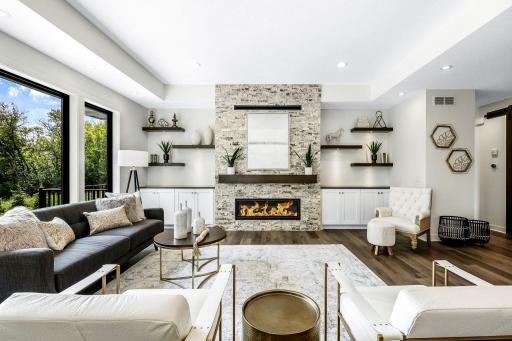 Entertainment size living room boast 21x18 ft, In floor electrical outlets in main living spaces. Floating shelves with remote controlled lighting.