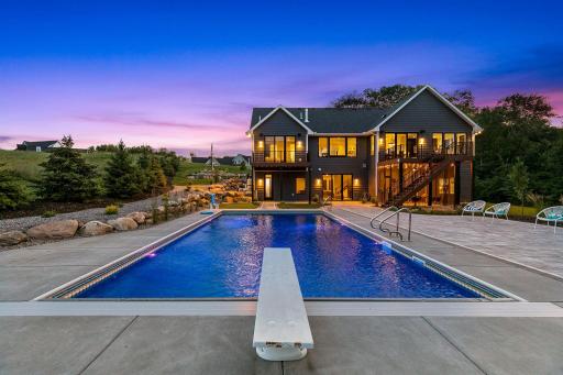 Enjoy your saltwater pool in the back w/professional landscaping, gas firepit & screened-in porch. The setting here is amazing. The pool offers ledges at each end with steps to just relax. electric cover and underwater lighting. Electric cover.