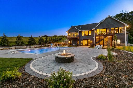 Amazing patio with natural gas firepit, perfect for those late night smore's. This is also has wiring and water already run for a future outdoor bar. "right behind the chairs in the photo"
