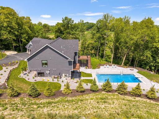 New landscaping completed in the fall of 2022. French drain along tree line to capture rain water. New plants around the entire yard. Retaining walls.