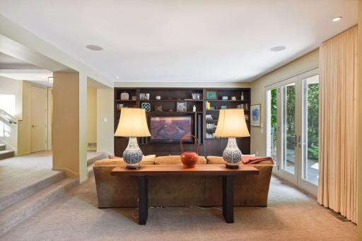 The walkout lower level highlights the family room, wet bar, wine cellar, exercise room, two bedrooms, two bathrooms, and a sauna.