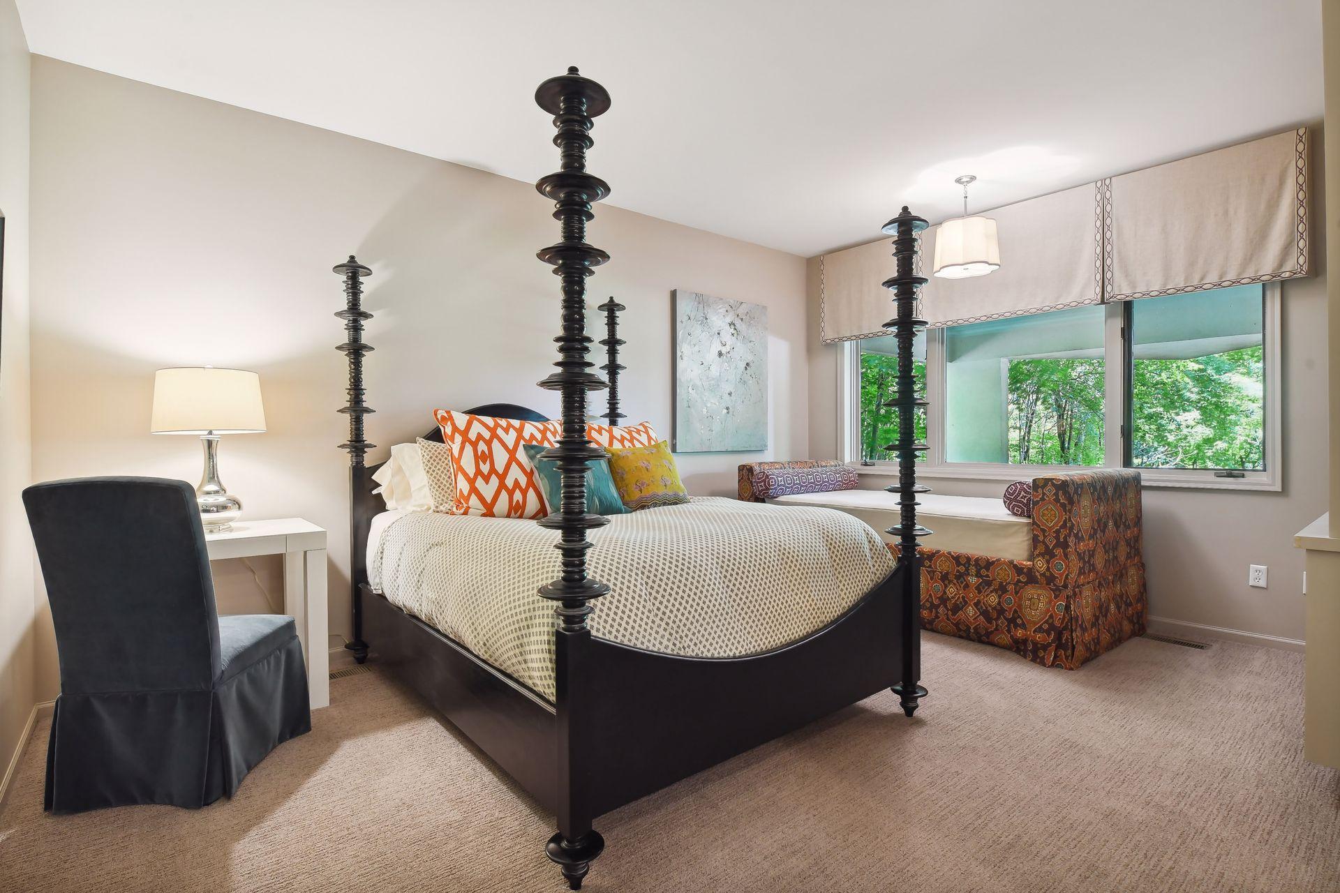 The lower level includes one guest bedroom suite with jetted tub and an additional bedroom with adjacent three-quarter bathroom.