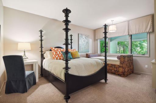 The lower level includes one guest bedroom suite with jetted tub and an additional bedroom with adjacent three-quarter bathroom.