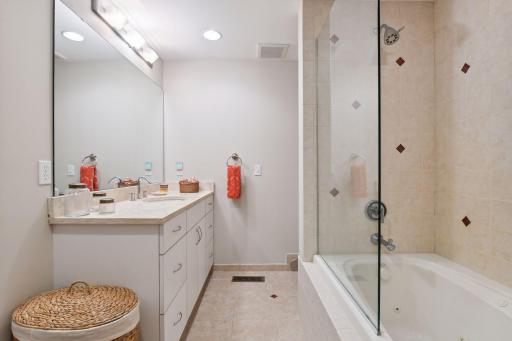 Your guests will enjoy the jetted tub in this private bathroom.