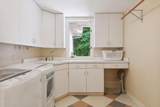 There is plenty of cabinet and counterspace in the main floor laundry.
