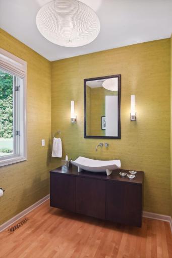 The guest bathroom is located off the foyer.