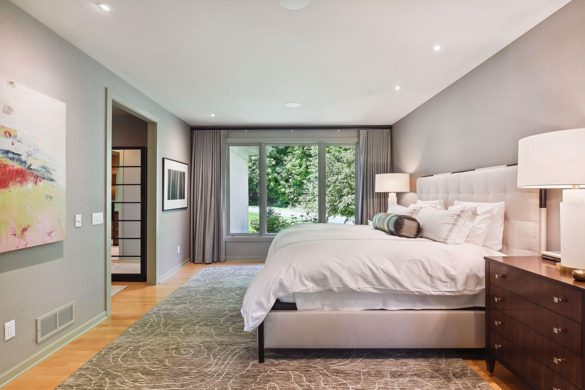 Solid maple floors span across the primary bedroom.
