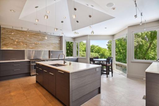 Completely renovated, the spacious designer kitchen offers high end touches from lighting to custom cabinetry to heated floors. No detail was missed in the design of the gourmet kitchen, winner of a prestigious architectural design award.