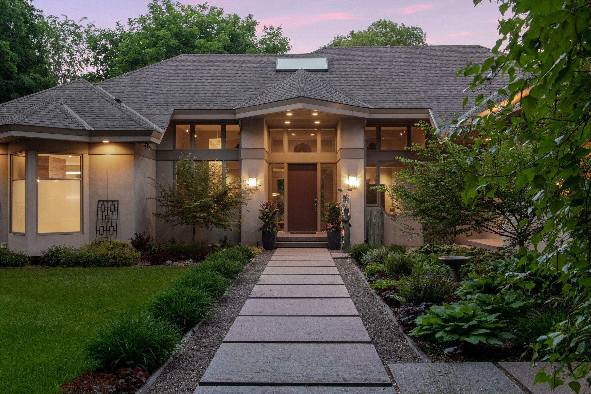 This beautiful granite paver walkway leads the way to the grand foyer. Welcome home!