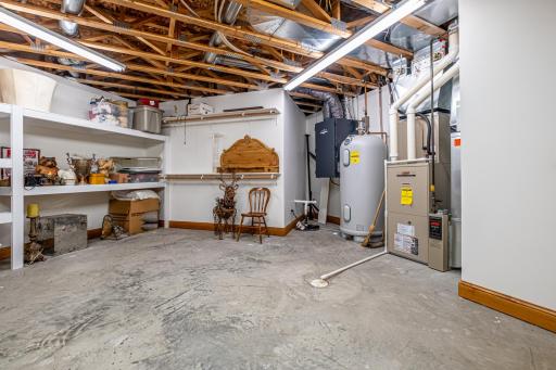 2nd mechanical and storage area features an additional Lennox furnace, water heater, and sump pump.