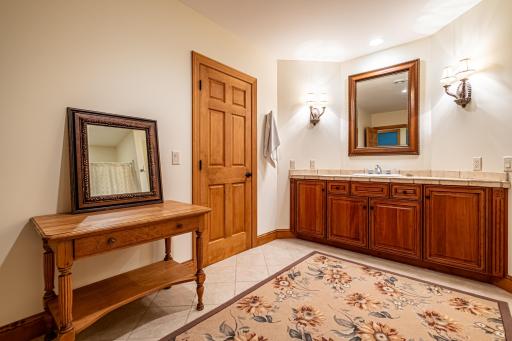 Lower level full bathroom features recessed lighting, tile flooring, and a tub and shower combination.