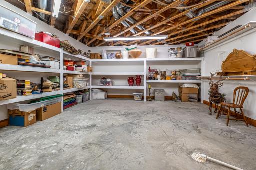 2nd mechanical and storage area features an additional Lennox furnace, water heater, and sump pump.