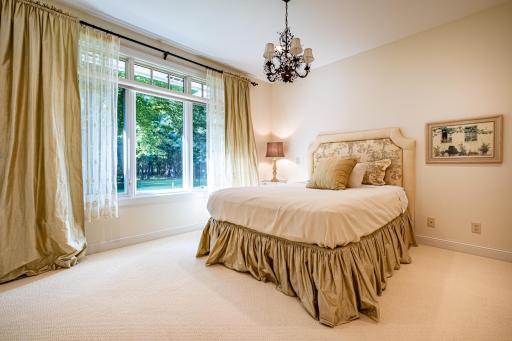 2nd bedroom on the main floor features a large picture window, recessed lighting, and a chandelier. Access to a 3/4 bathroom.