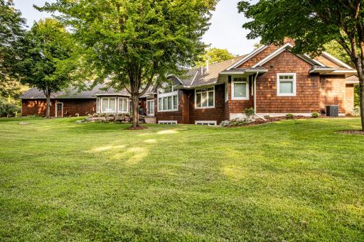 Home features in-ground sprinklers with soft water near the house.