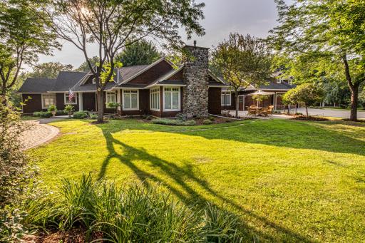 Home features in-ground sprinklers with soft water near the house.