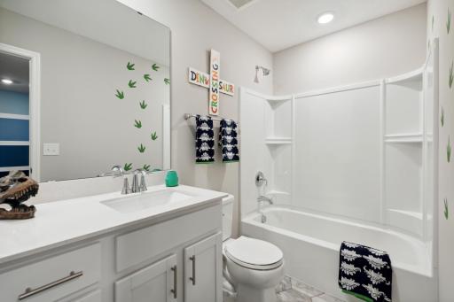 The home's secondary bath features a vanity with extra space to help keep everyone moving during those busy mornings. *Pictures are of model home; Colors and options may vary