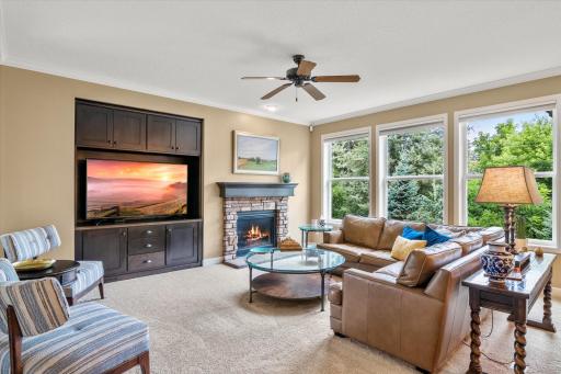 Main level living room with built-ins and a gas fireplace.