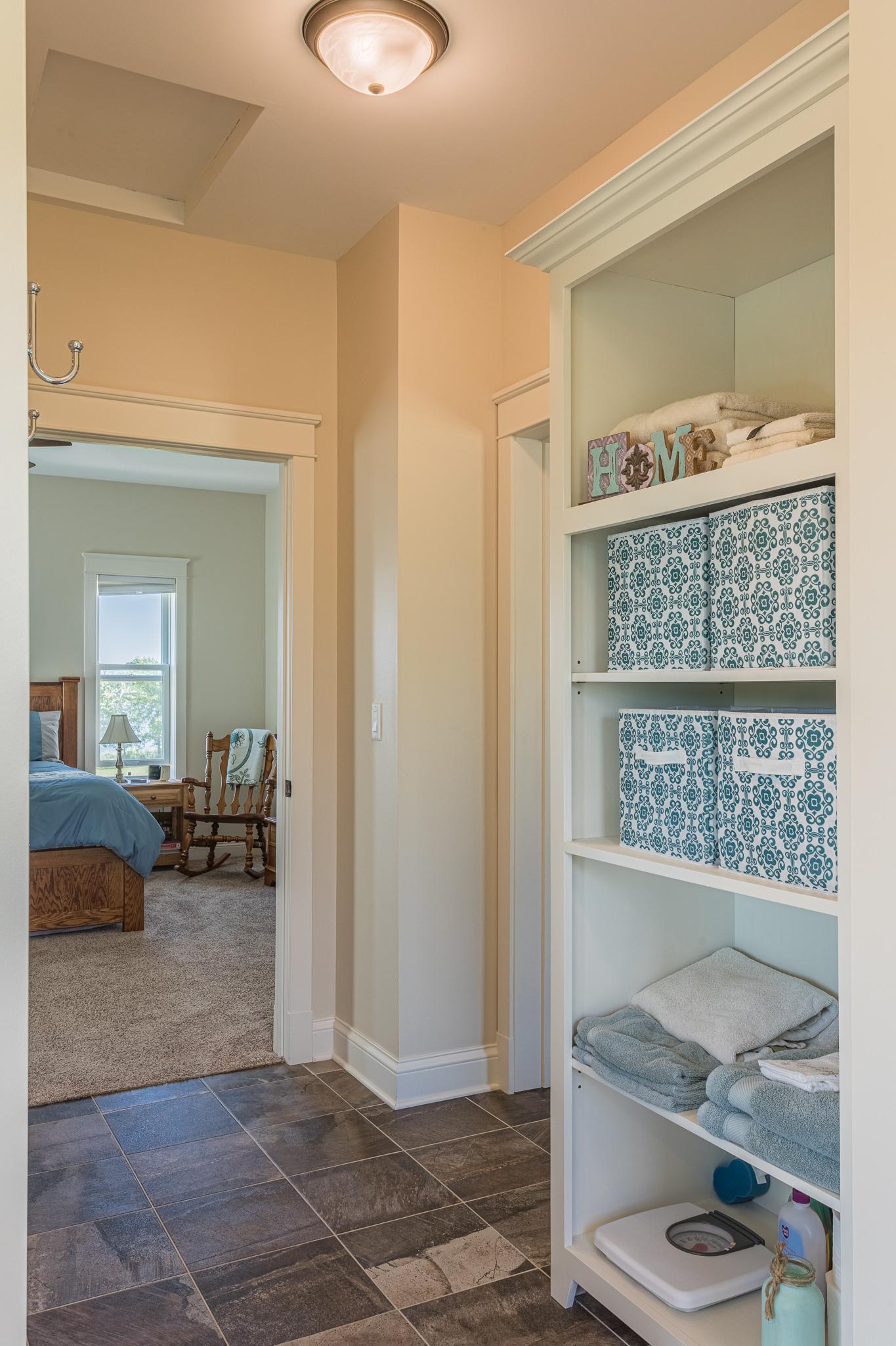Hallway w/ view of primary bdrm