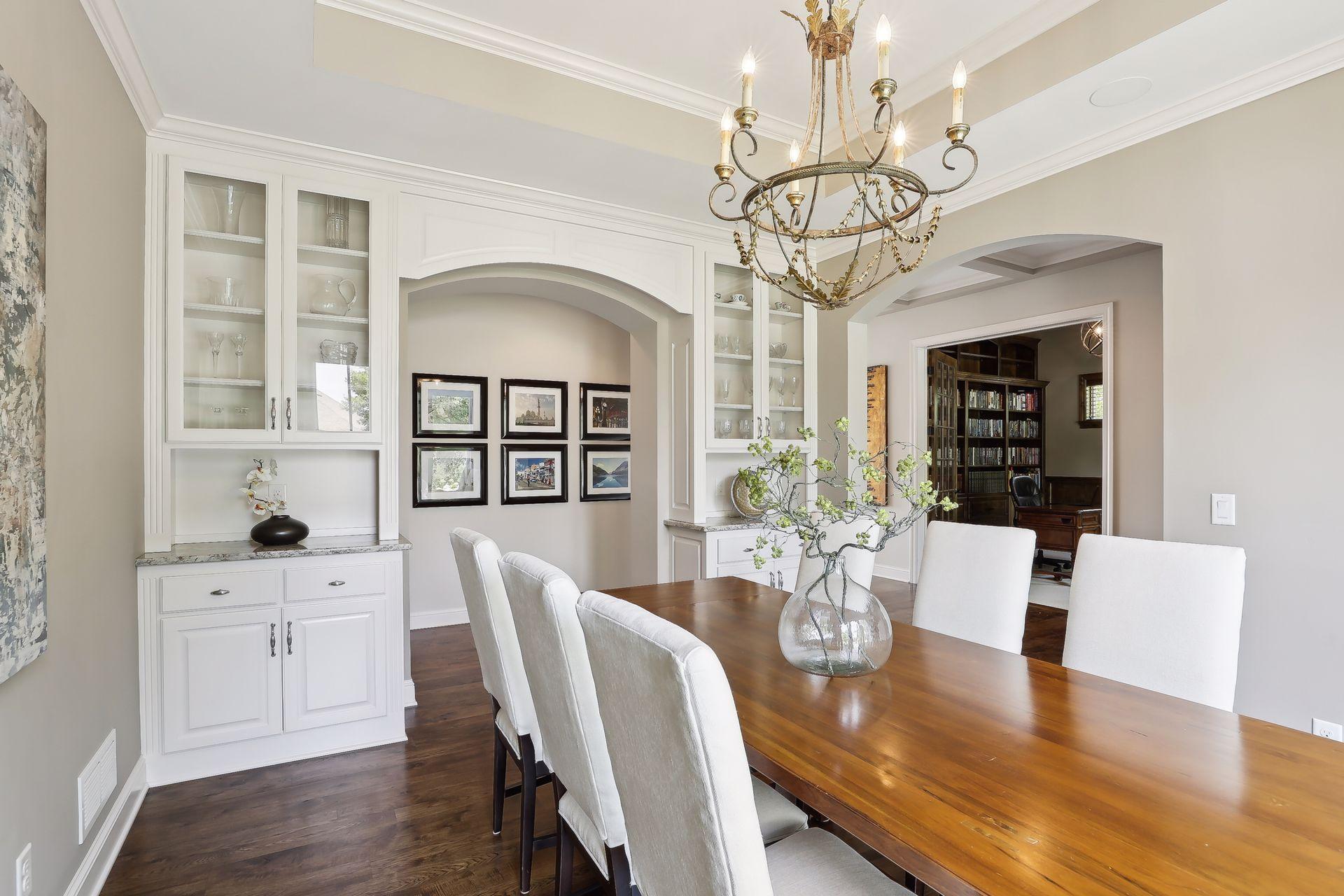 Light and bright formal dining room with built-ins.