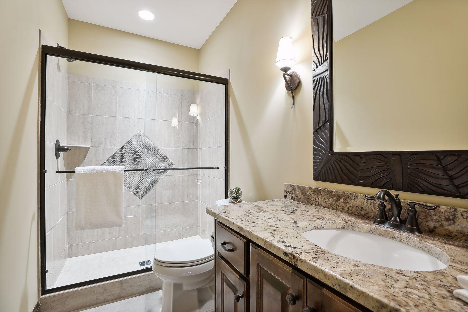 Three-quarters bathroom that services the lower level.