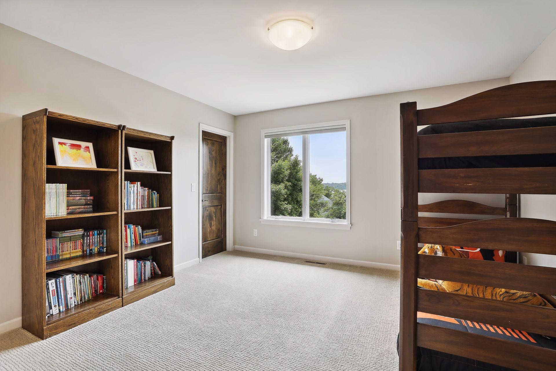 Second junior bedroom with walk-in closet and three-quarters bathroom ensuite.