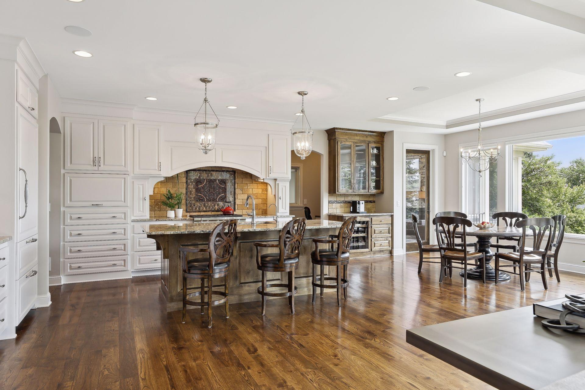 Spacious gourmet kitchen features Wolf and Sub Zero appliances.