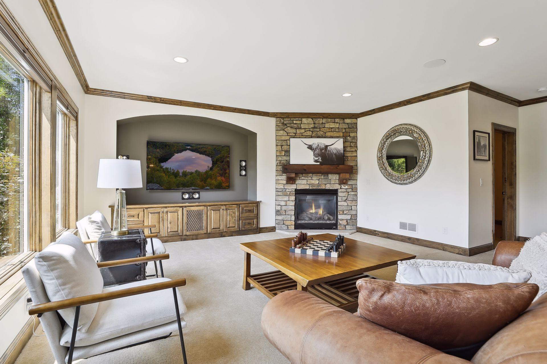 Movie theater area with gas fireplace.