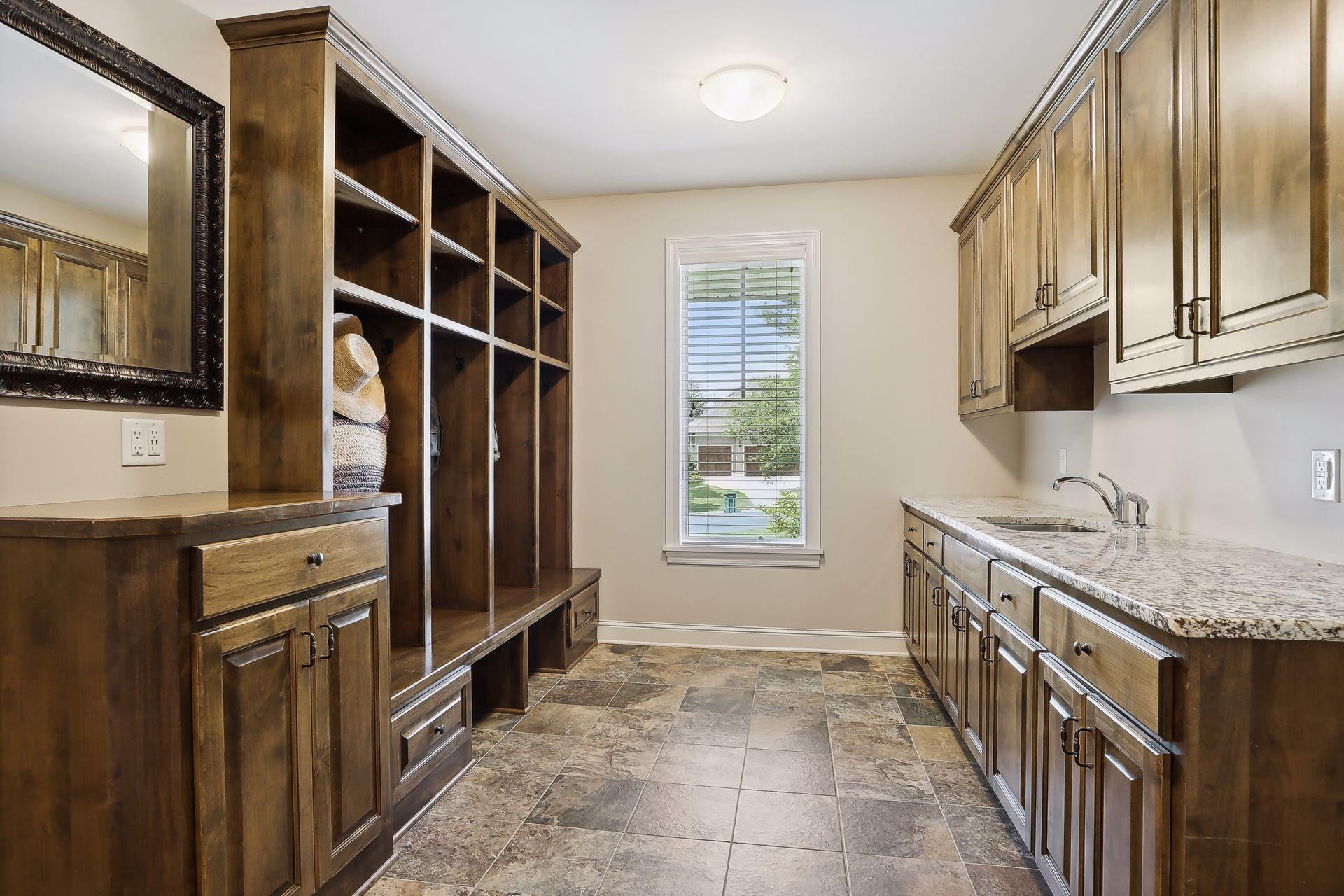 Full size mud room with built in lockers with plenty of storage.